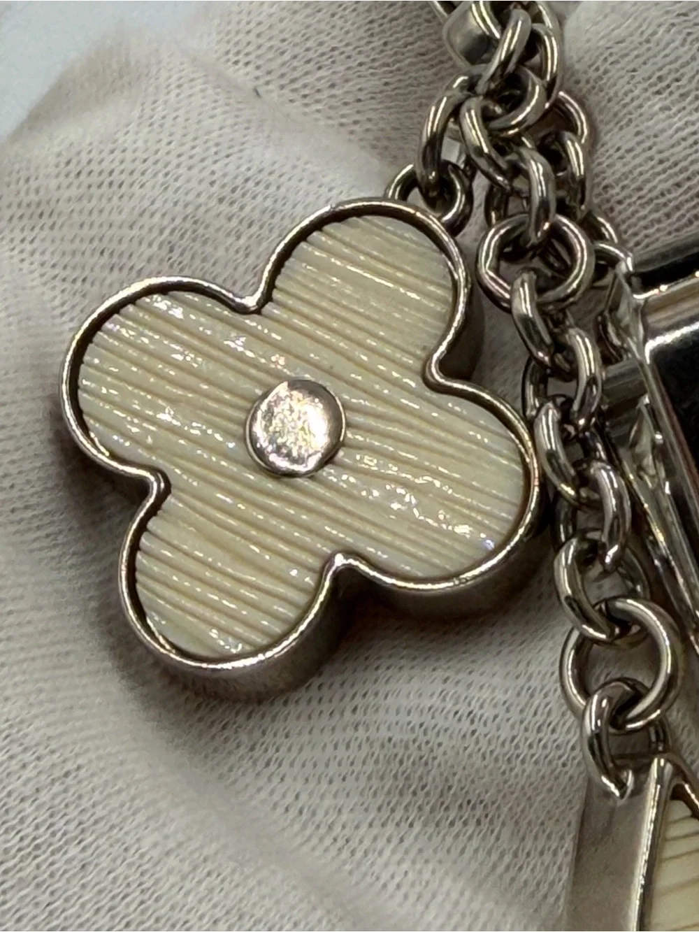 Authentic Louis Vuitton Fleur d’Epi Silver & Cream Bag Charm w/Dust Bag and COA